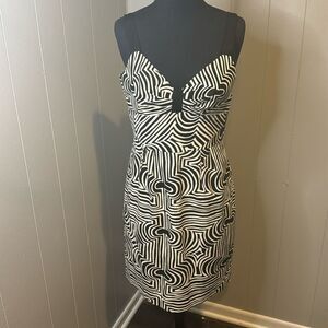 Trina Turk black/white geometric print black grosgrain ribbon strap sheath midi.